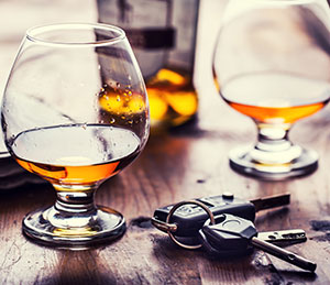 Two glasses of alcohol and keys on a table - Top Gun DUI Defense Attorney Myles L. Berman